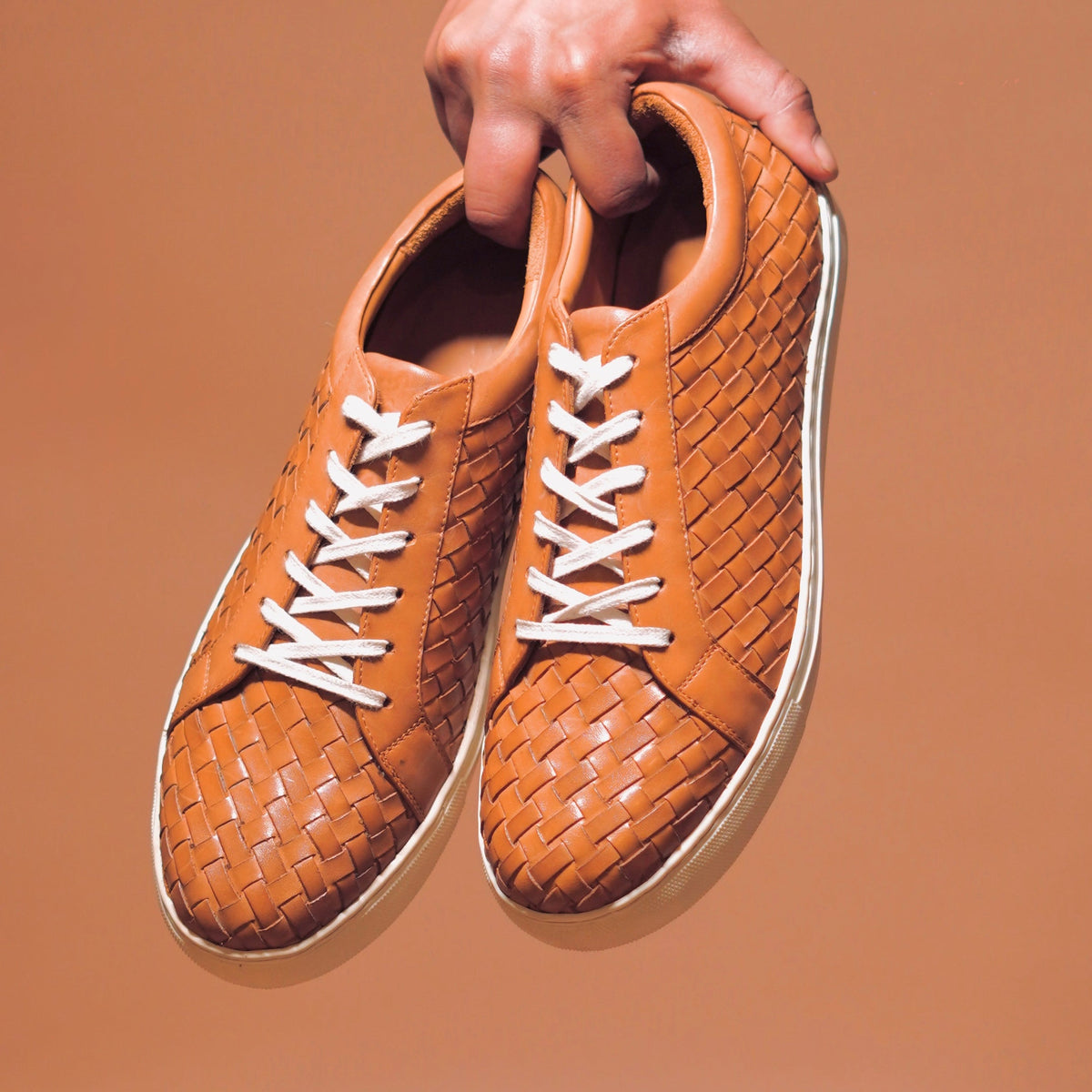 Top view of Scarpo Tesso highlighting its classic tan hue and white laces