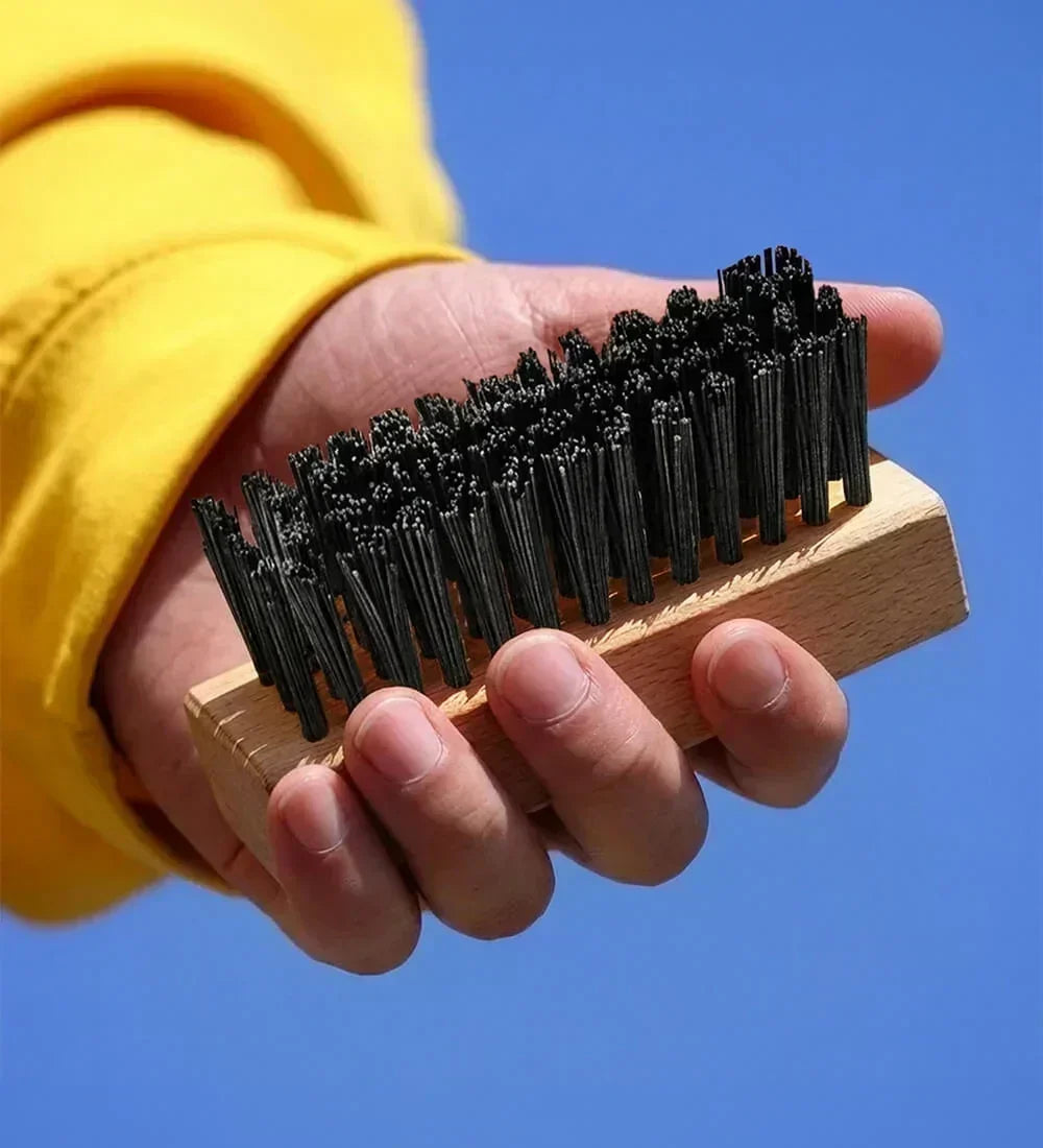 Man Holding SHOEGR Hard Shoe Brush