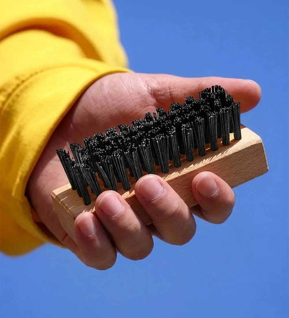 Man Holding SHOEGR All-purpose Shoe Brush