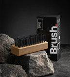 SHOEGR All-purpose Brush with Short Black Bristles for Cleaning Sneakers and Shoes on a Black Background with its packaging.