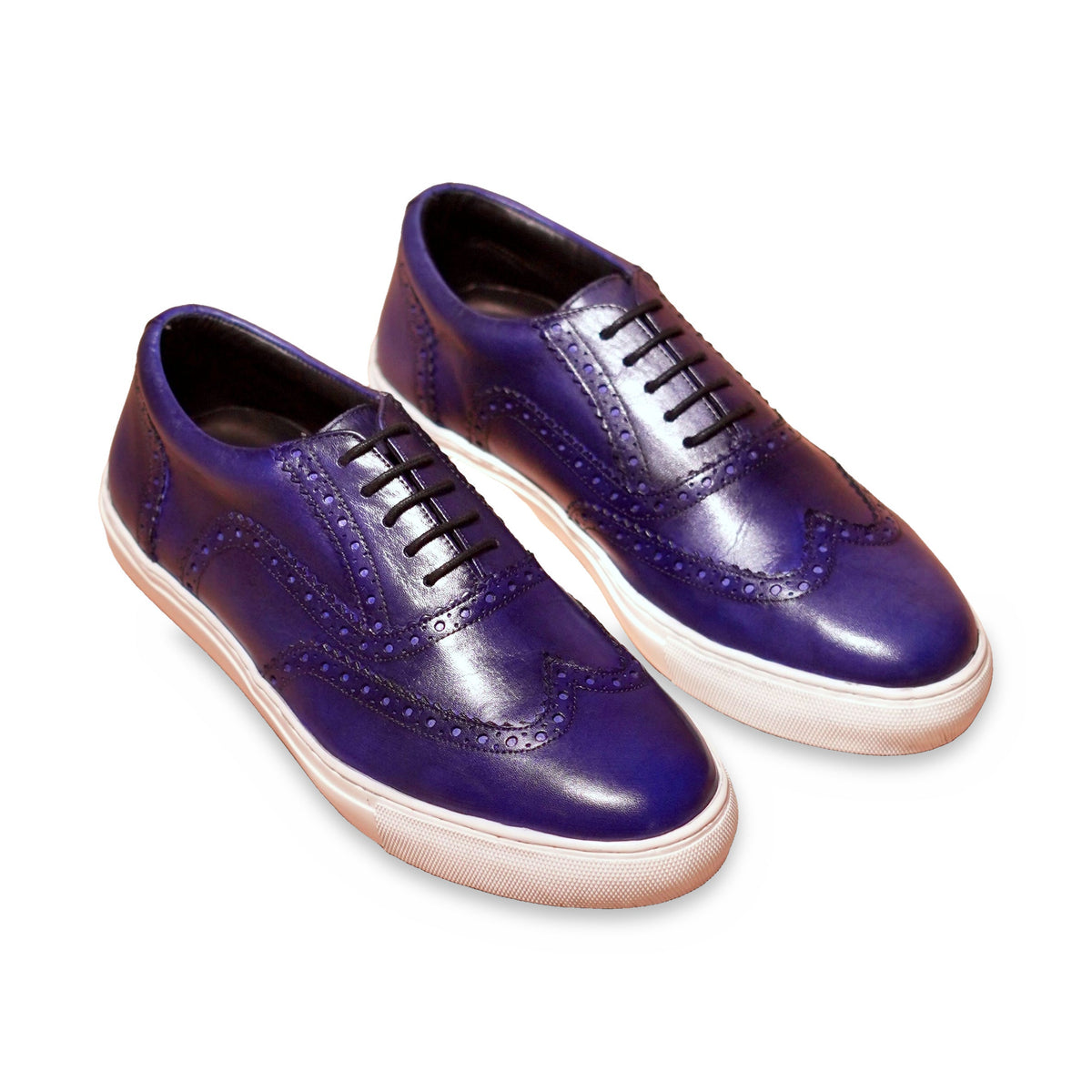 Cobalto | Classic deep blue leather brogue sneaker on white background