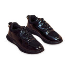 Sportivo | Black patent leather and suede sneakers on white background